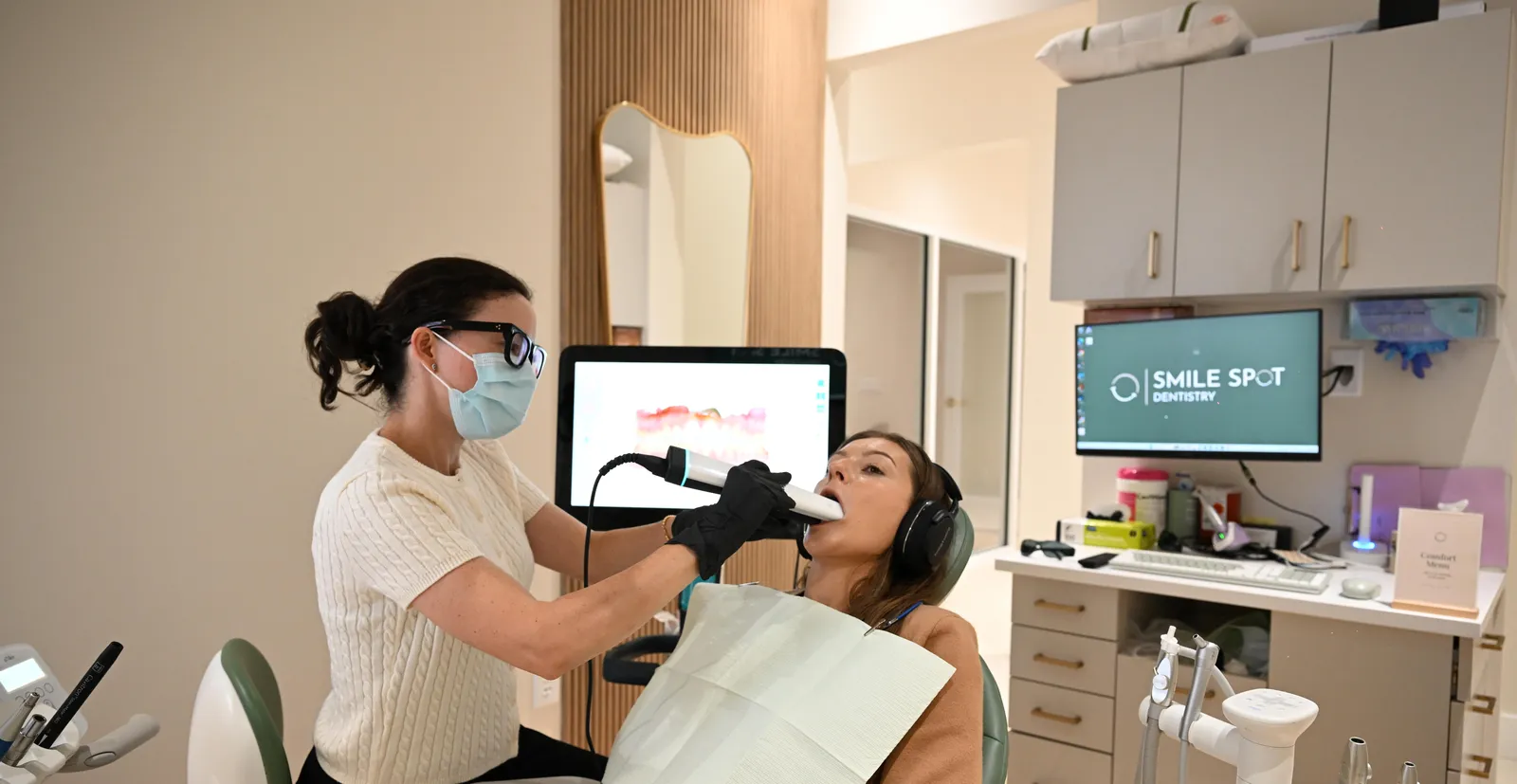 Digital records — dental assistant taking an iTero scan, model on screen — Smile Spot Dentistry, Venice FL