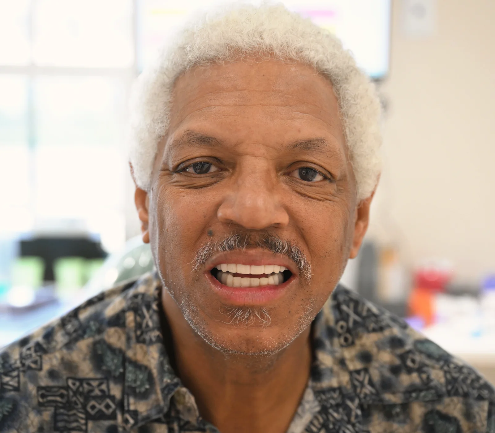 Dental implant patient smiling with his new teeth at Smile Spot Dentistry, Venice FL