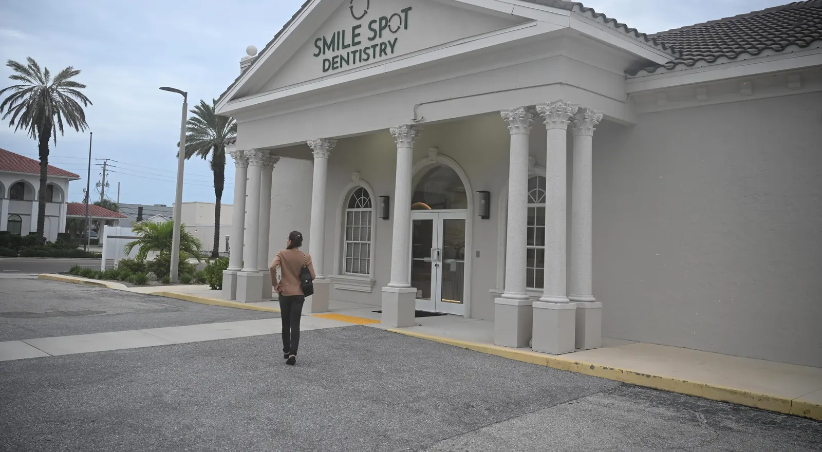 The exterior entrance of Smile Spot Dentistry with signage visible, Venice FL