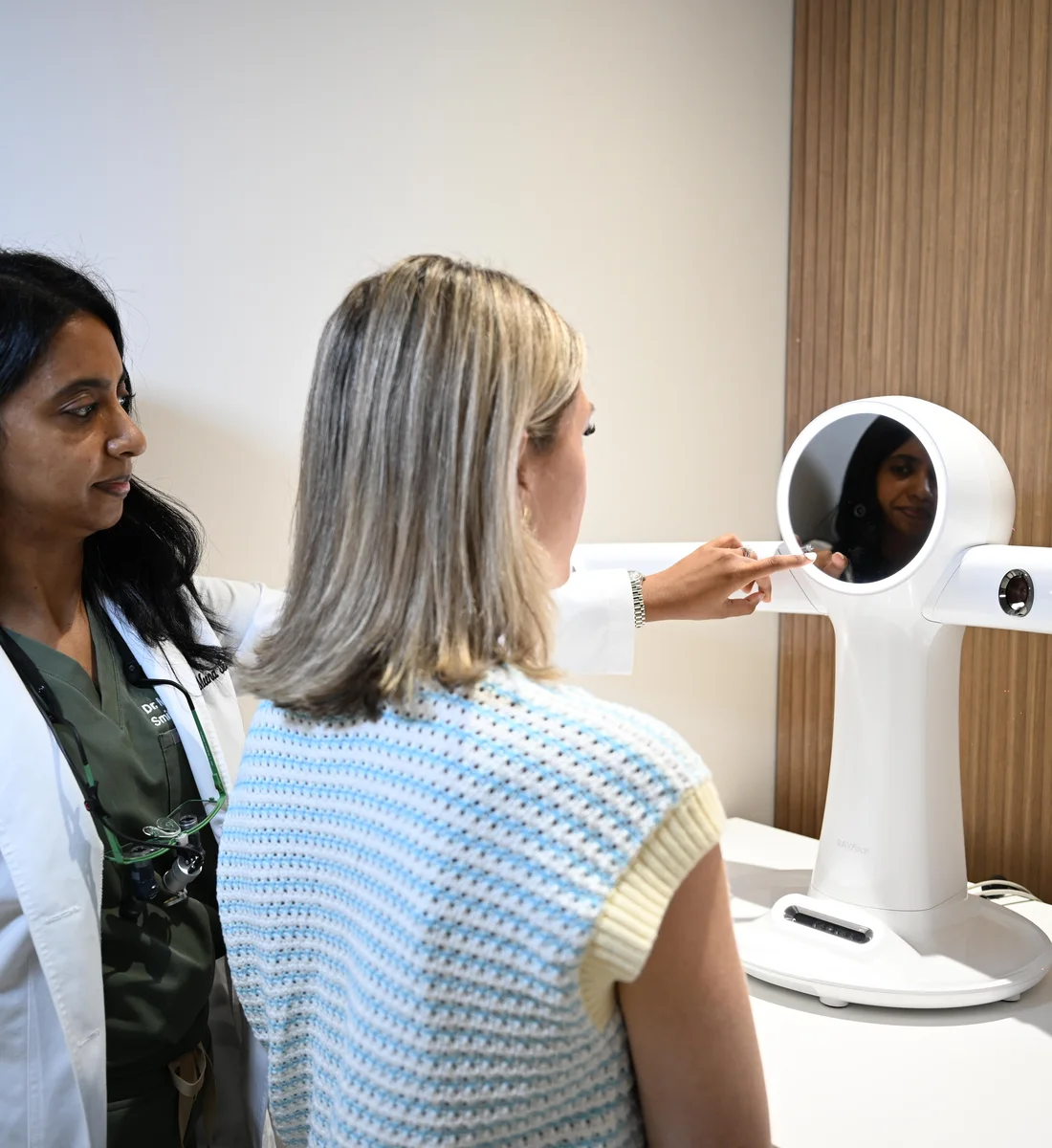 Dr. Sellappan with a patient at the RAYFace 3D facial scanner — Smile Spot Dentistry, Venice FL